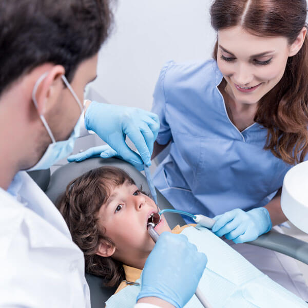 child receiving dental exam